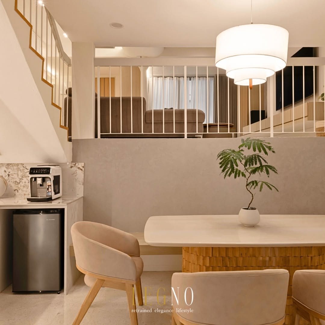 Dining area connected to the reworked split-level landing after circulation was replanned in a Penang terrace house