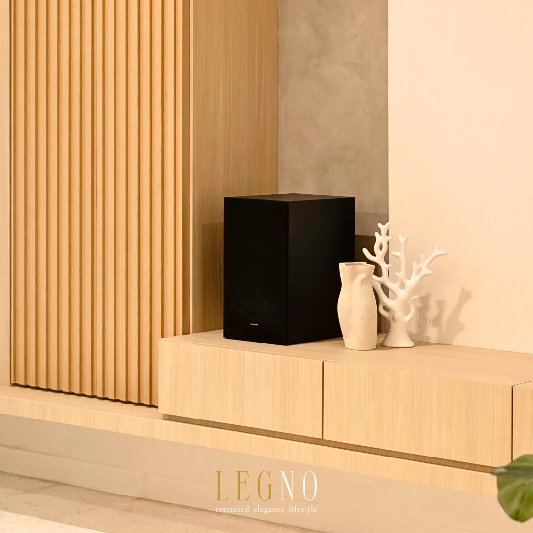 Fluted timber wall panel and light oak TV console detail in a Penang interior design project